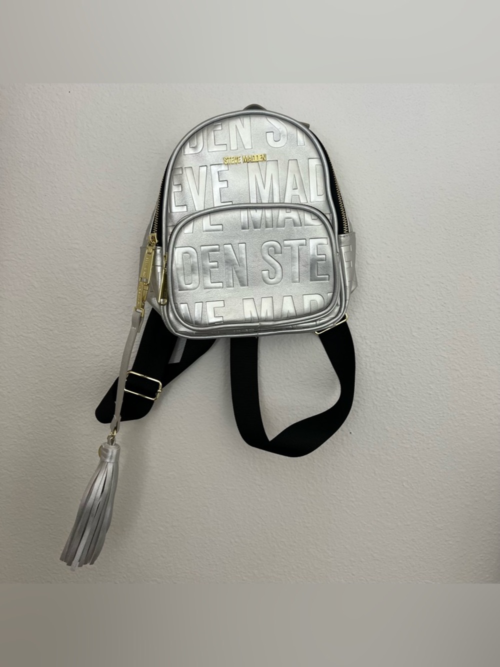 Steve Madden Metallic Silver Logo Mini Backpack with Tassel